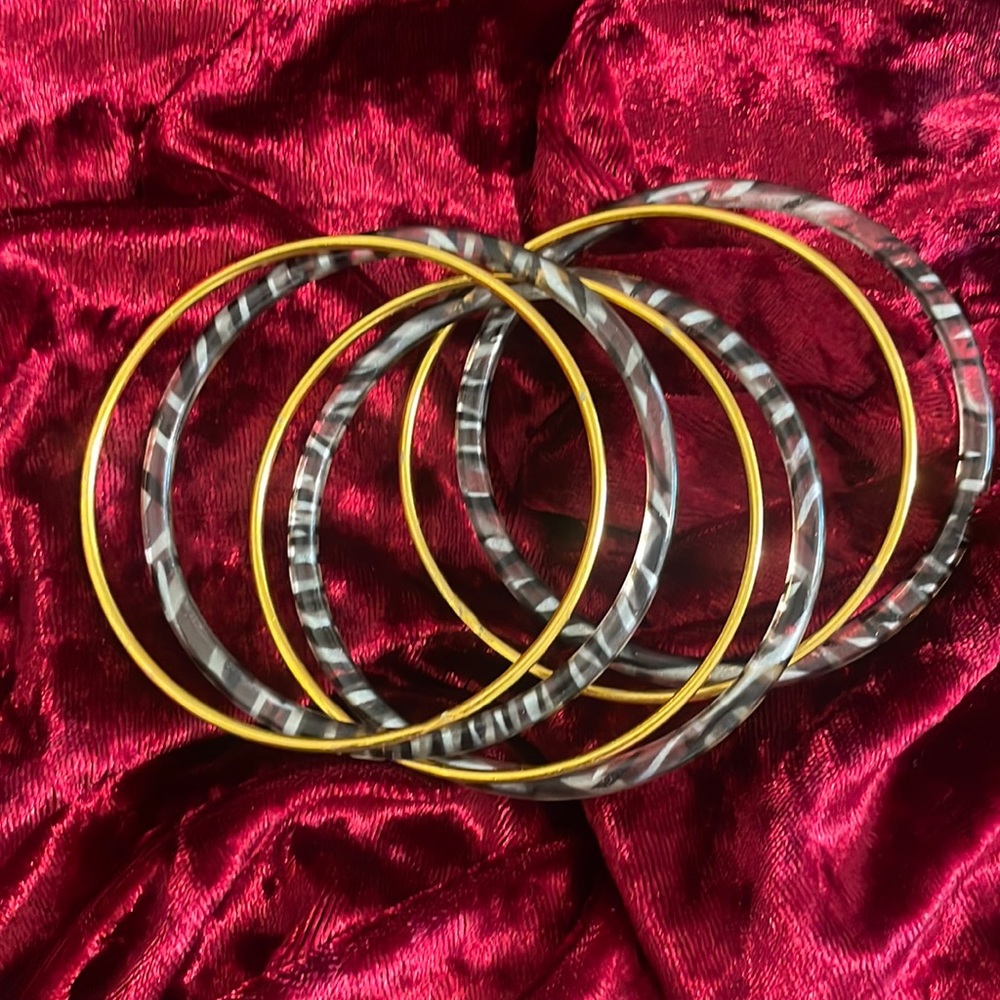 Gold and black bangles